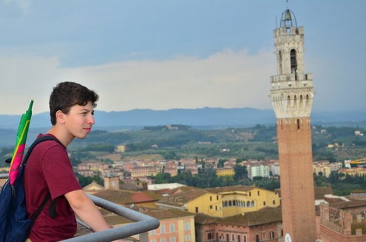young student boy at a tourist site
