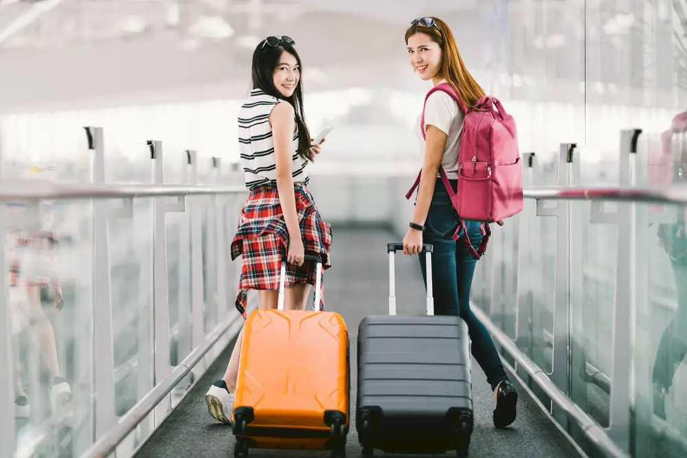 Two happy, traveling students.